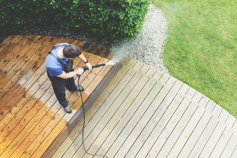 Man,Cleaning,Terrace,With,A,Power,Washer,-,High,Water